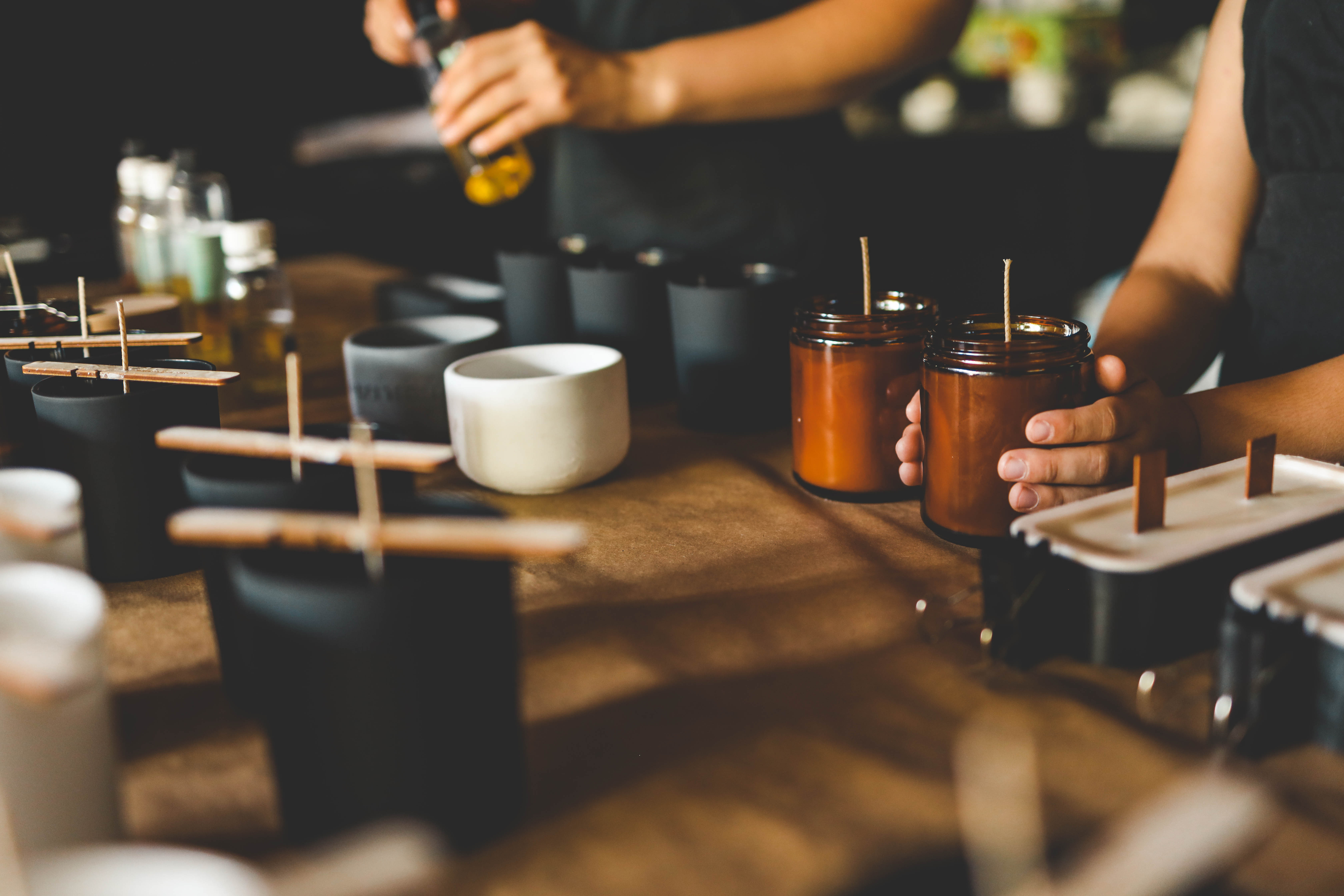 Handcrafted concrete tray with candle and small objects in natural light